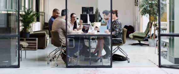 Business people discussing in meeting at creative office | © GettyImages