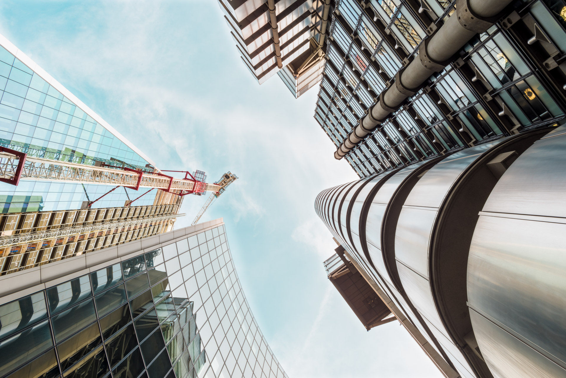 City of London skyscrapers area sky low angle view looking up view from the street with reflection on facades and architecture details of the Lloyds building, The Pinnacle and Willis Tower seen from the bottom on a beautiful sunny summer day | © © Flora Luna